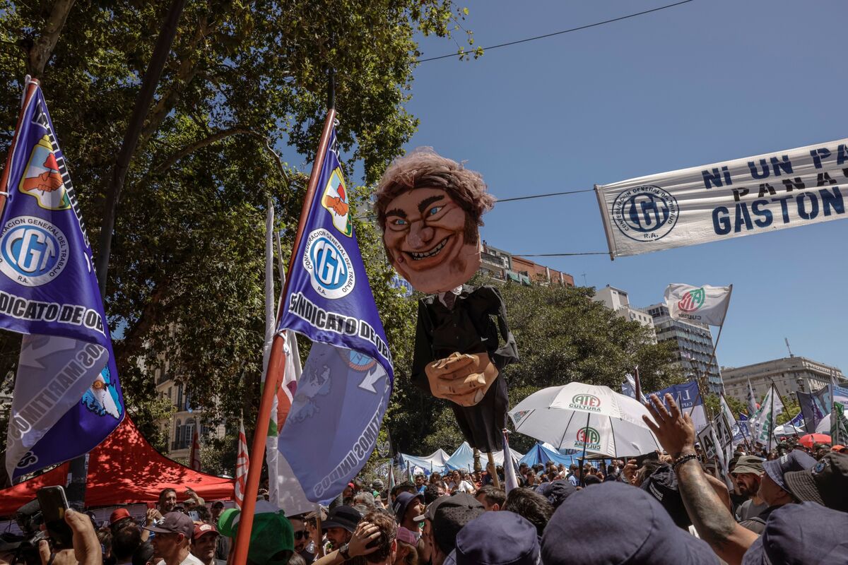 Protesters carrying union flags and a caricature of Javier Milei take to the streets during a general strike in Buenos Aires on Jan. 24.