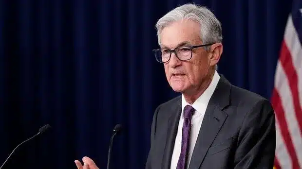 Fed Holds Rates Steady, Sees Slower Growth and Higher Inflation